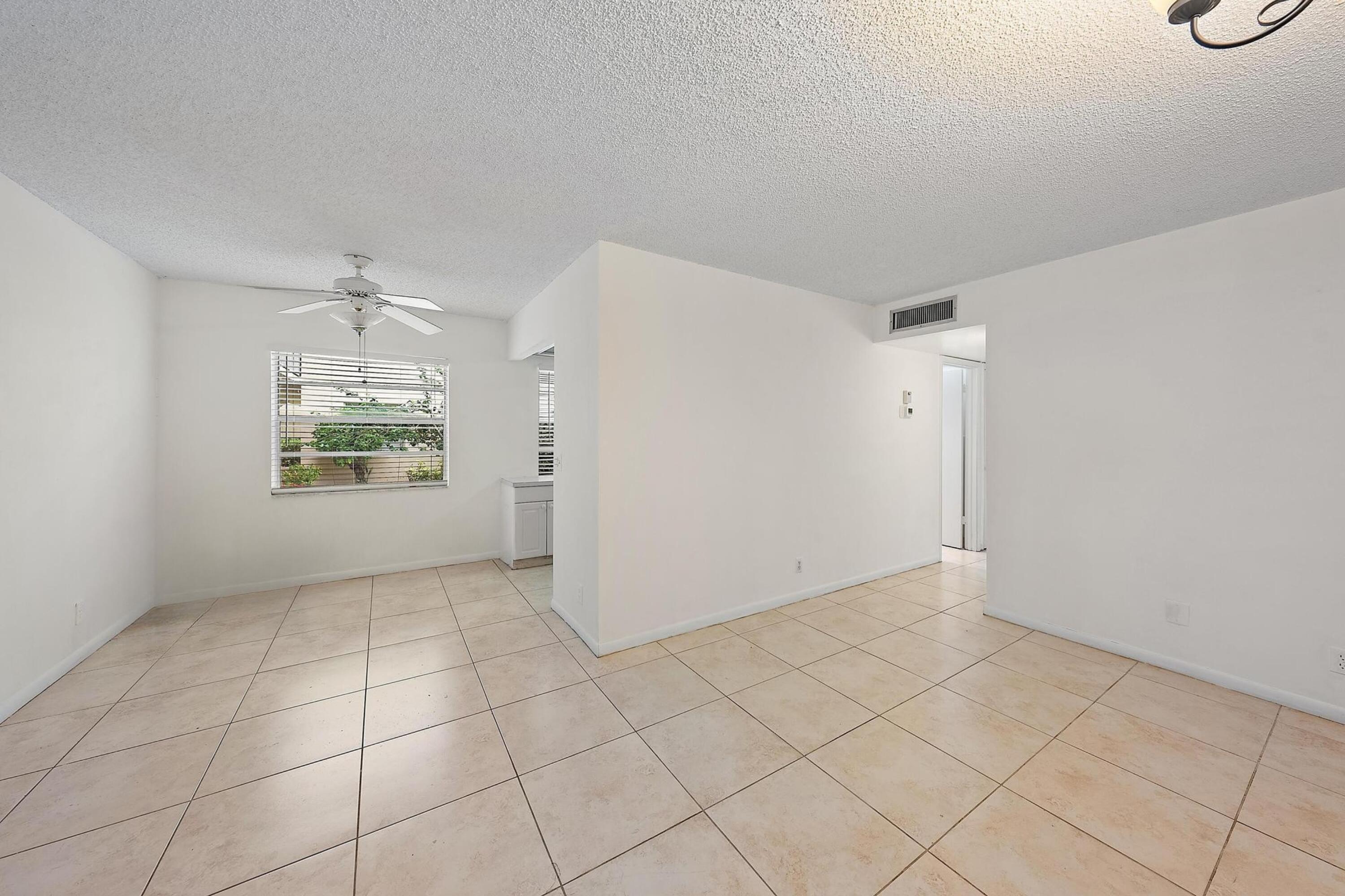 869 Flanders South Delray Beach, FL 33484 - Photo 2 of 13 an empty room with windows