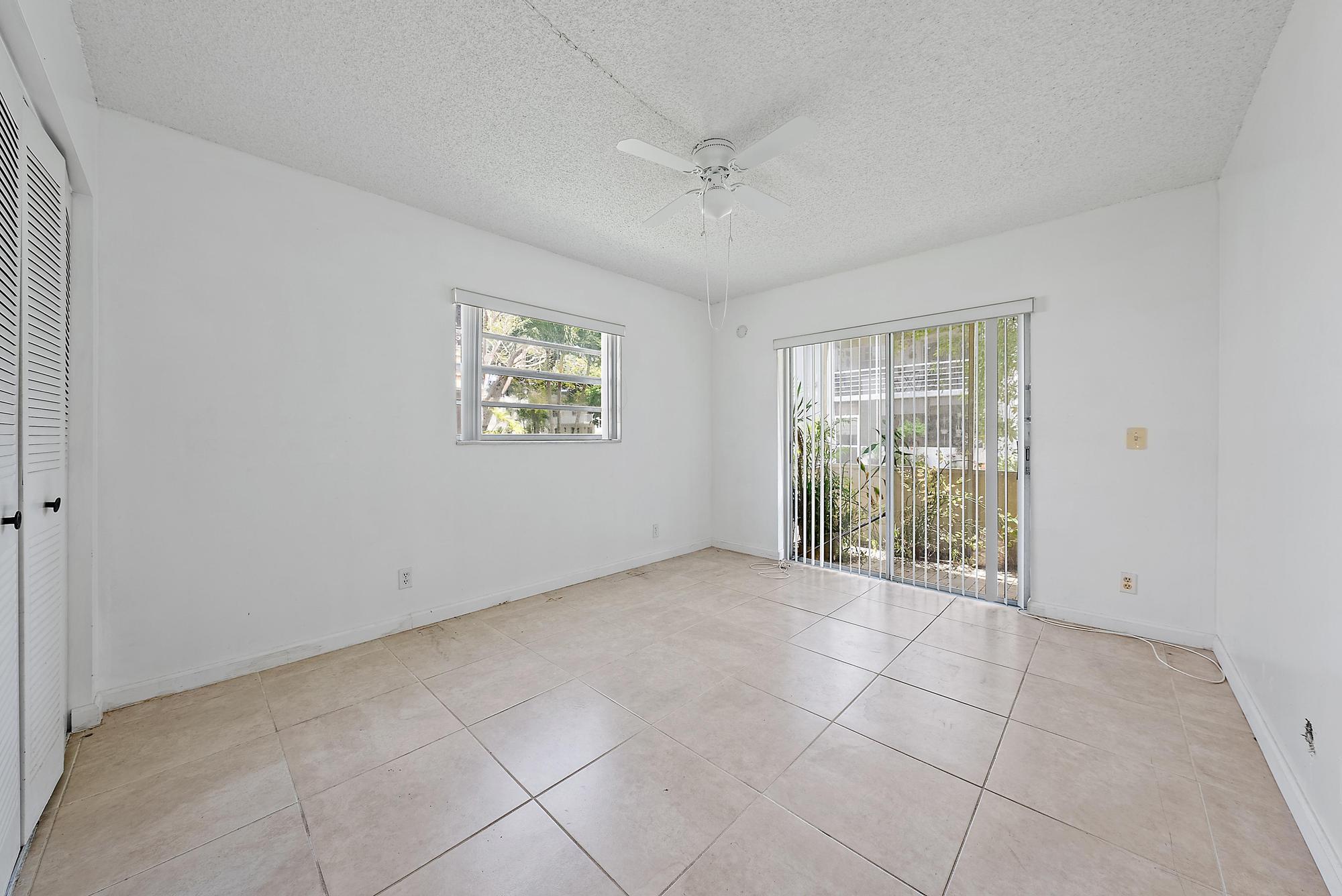 869 Flanders South Delray Beach, FL 33484 - Photo 5 of 13 a view of an empty room with a window