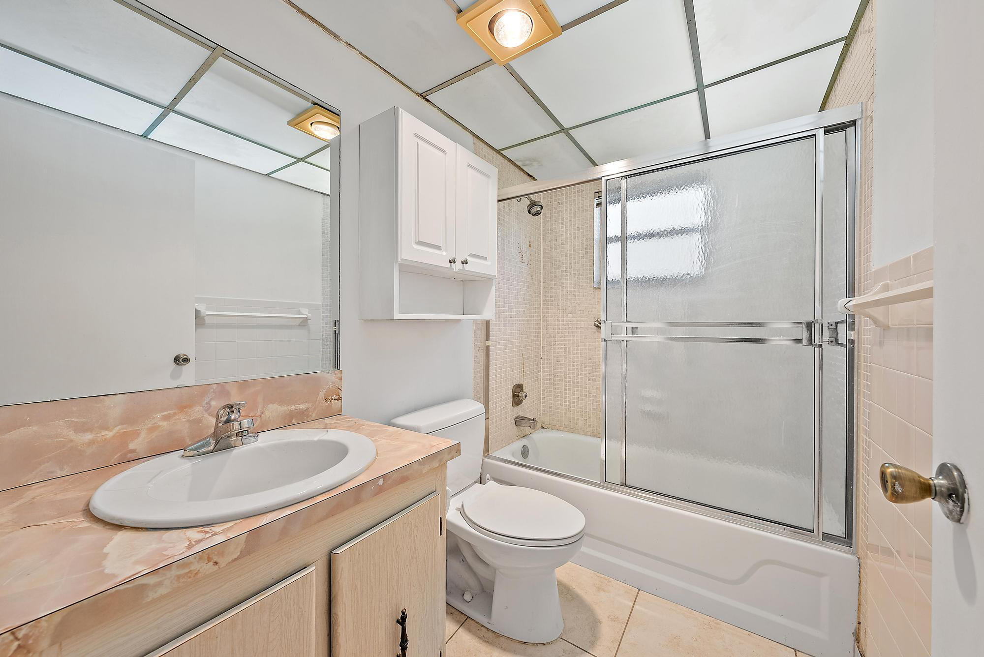 869 Flanders South Delray Beach, FL 33484 - Photo 7 of 13 a bathroom with a sink toilet and shower