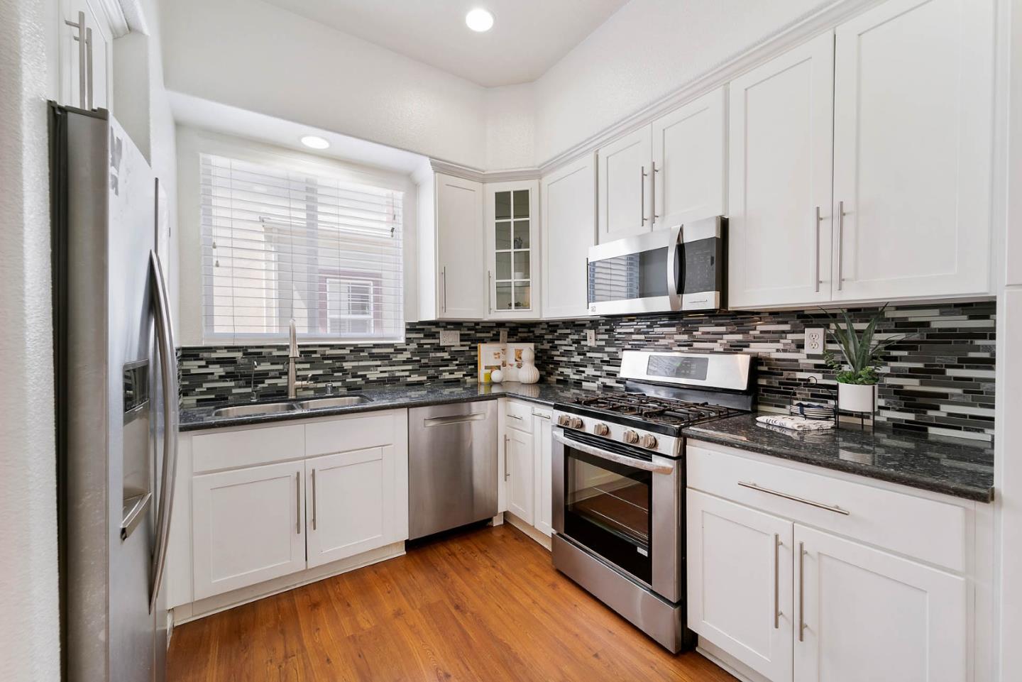43 Rain Walk Milpitas, CA 95035 - Photo 13 of 48 a kitchen with stainless steel appliances granite countertop a stove and a sink