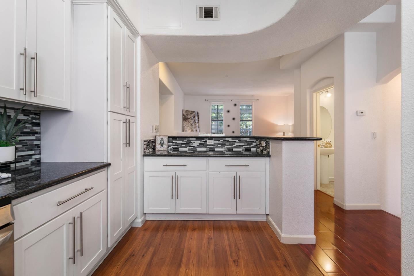43 Rain Walk Milpitas, CA 95035 - Photo 15 of 48 a kitchen with white cabinets and sink