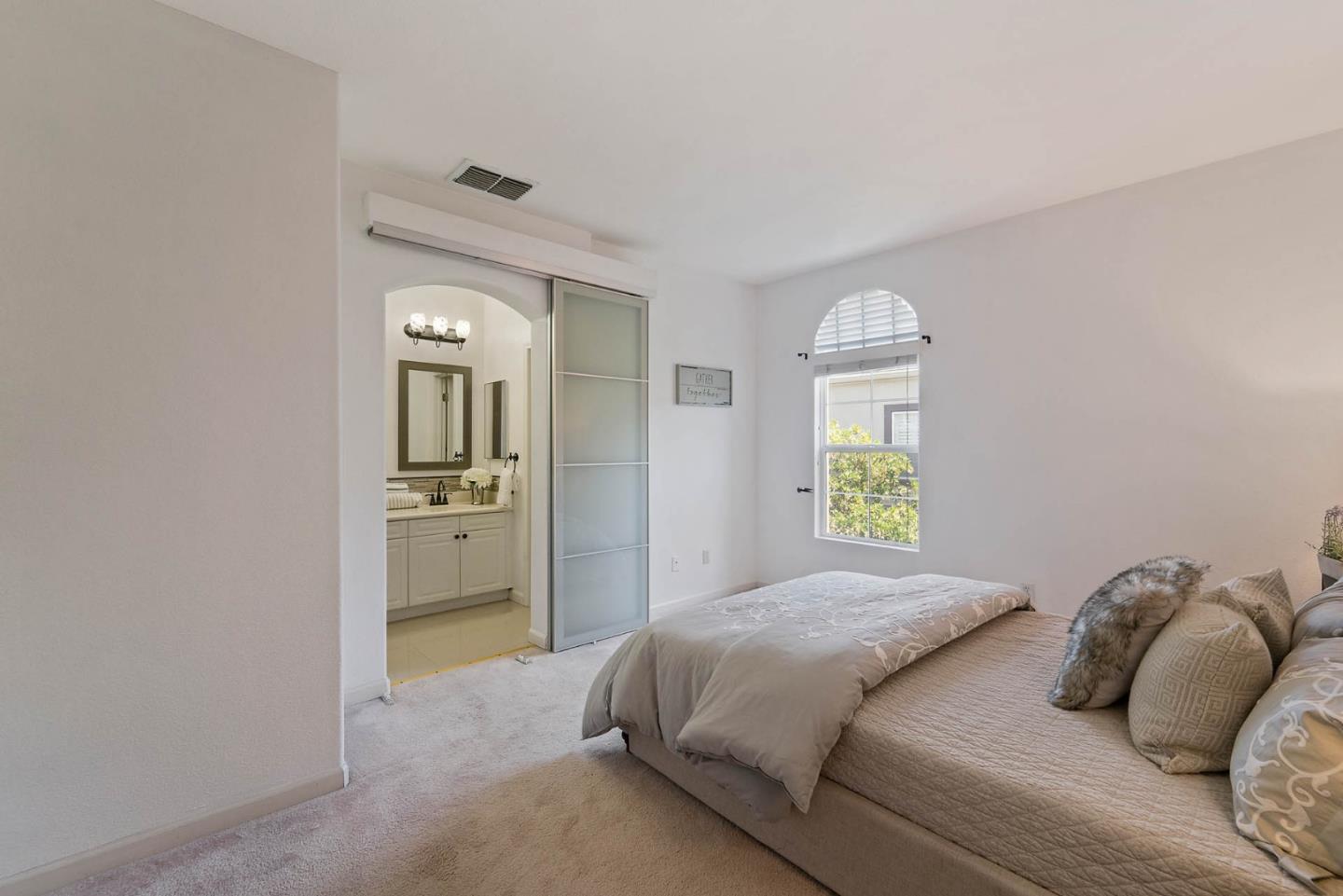 43 Rain Walk Milpitas, CA 95035 - Photo 18 of 48 a bedroom with a bed and a mirror