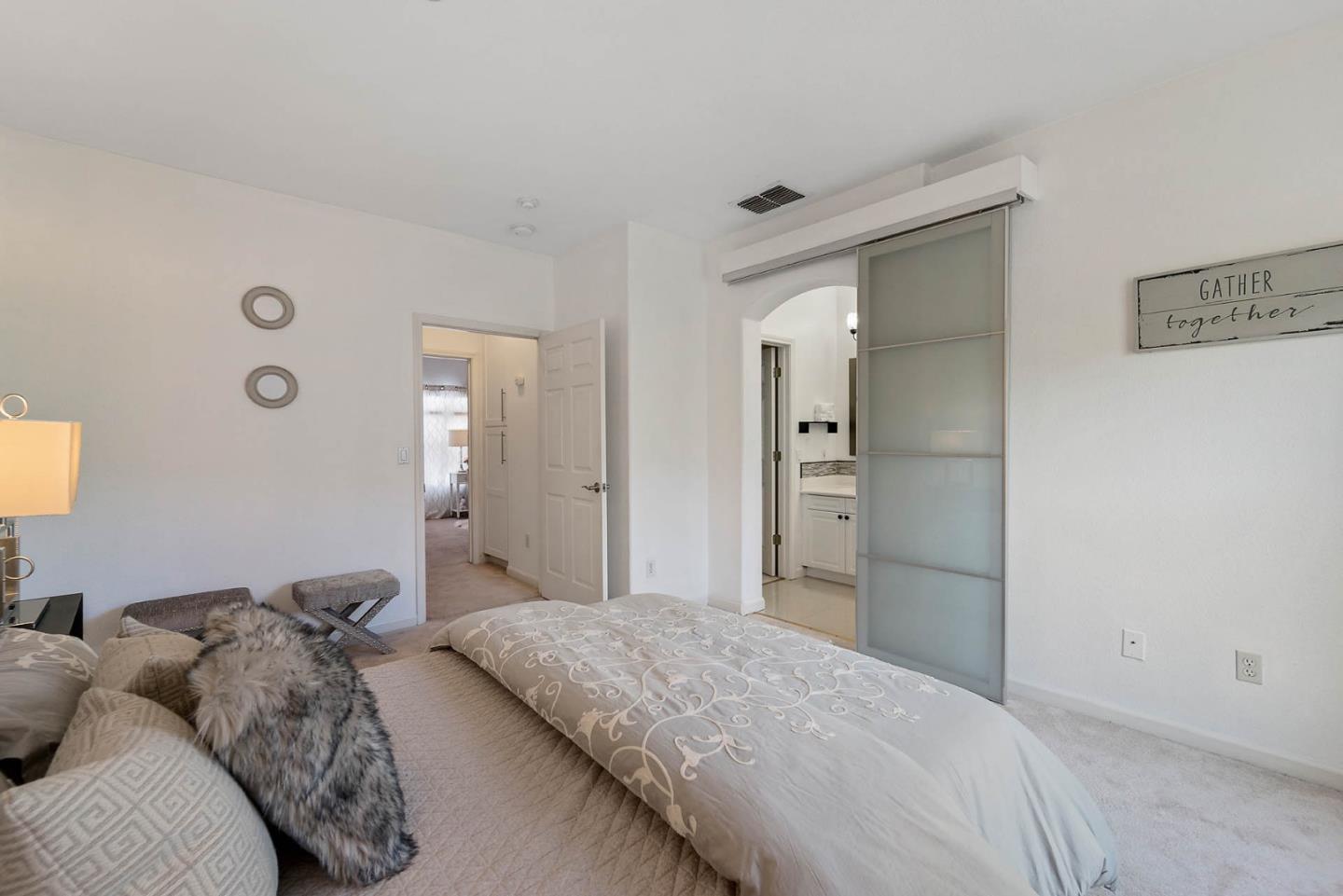 43 Rain Walk Milpitas, CA 95035 - Photo 19 of 48 a bedroom with a bed and a mirror