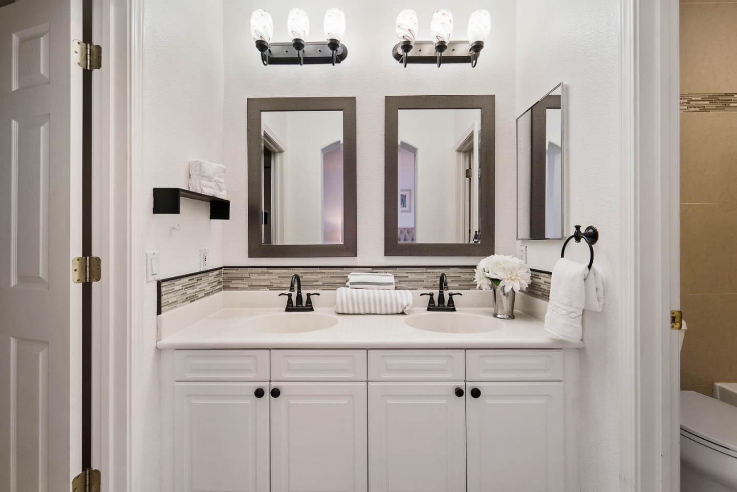 43 Rain Walk Milpitas, CA 95035 - Photo 20 of 48 a bathroom with double vanity sinks and a mirror