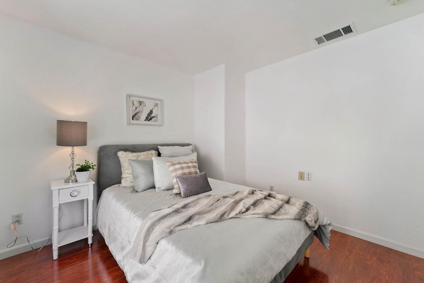 43 Rain Walk Milpitas, CA 95035 - Photo 25 of 48 a bedroom with a bed and a night stand