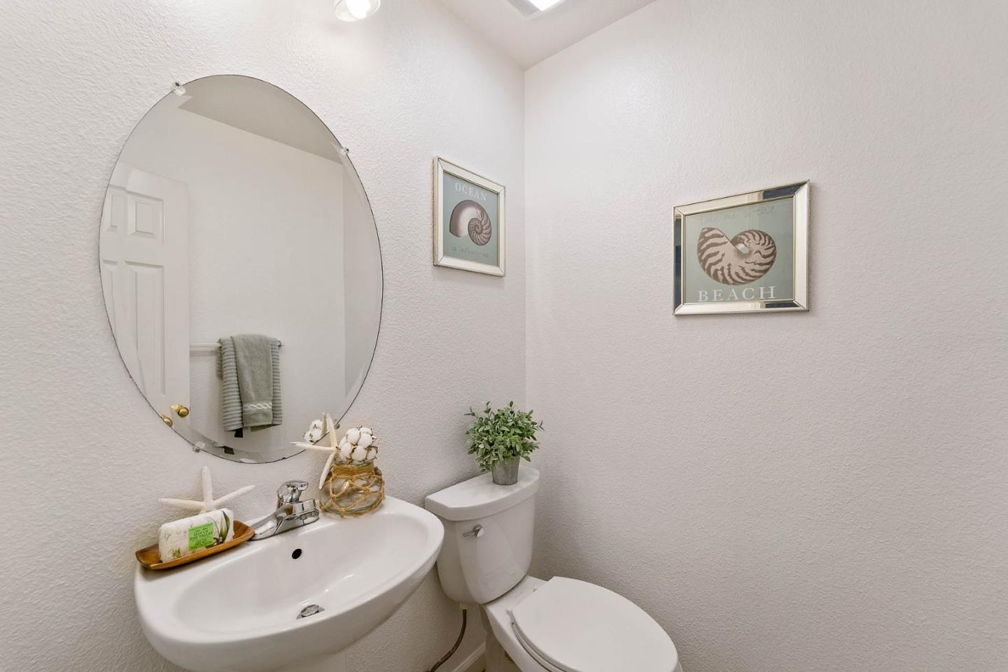 43 Rain Walk Milpitas, CA 95035 - Photo 26 of 48 a bathroom with a toilet a sink and mirror