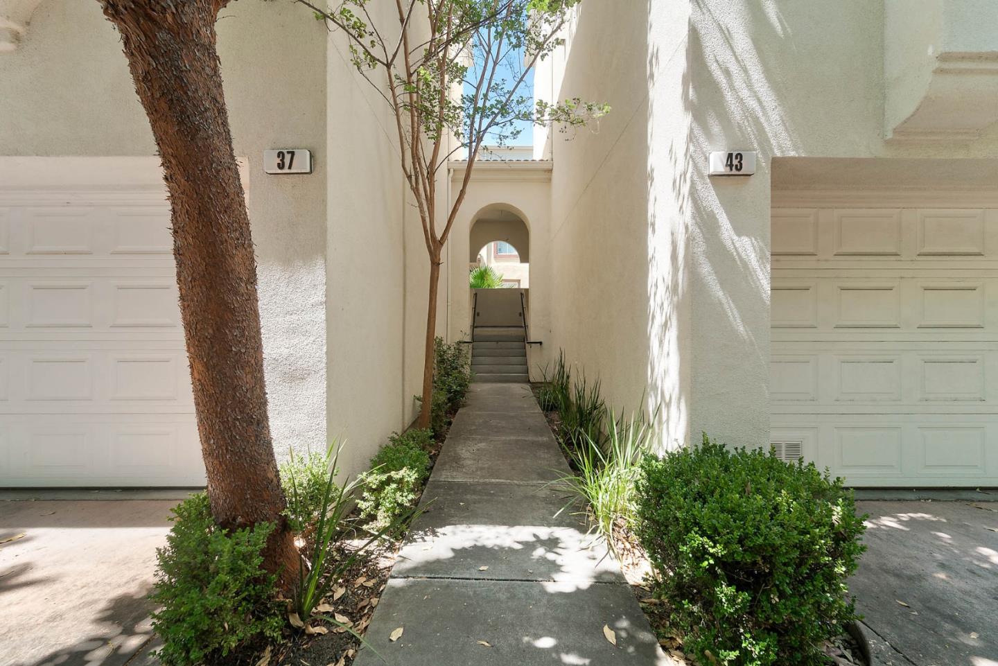 43 Rain Walk Milpitas, CA 95035 - Photo 3 of 48 a front view of a house with a pathway