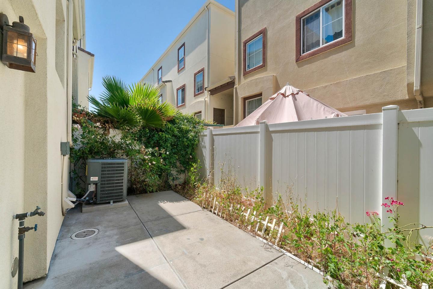43 Rain Walk Milpitas, CA 95035 - Photo 36 of 48 a view of a brick house with many windows