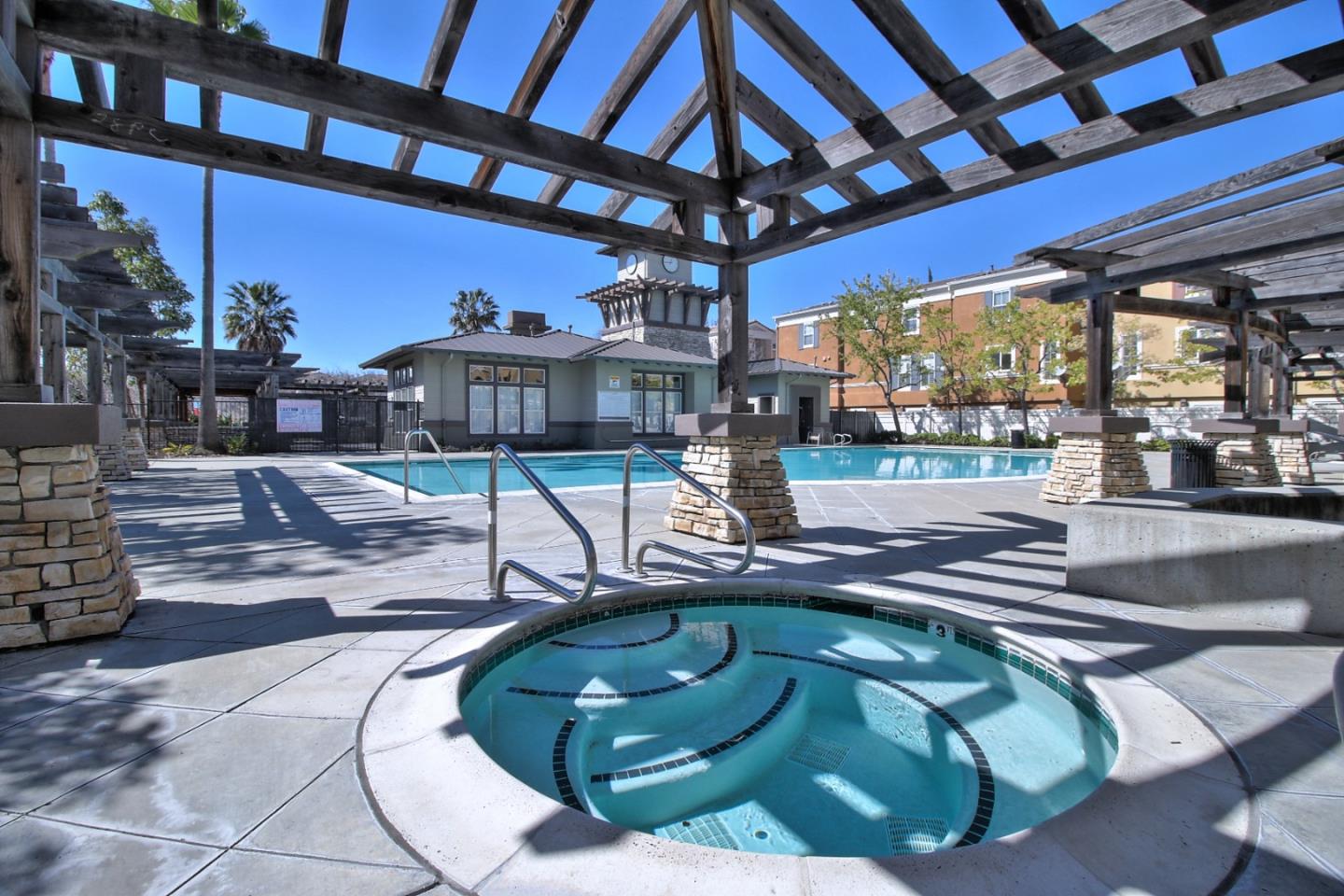 43 Rain Walk Milpitas, CA 95035 - Photo 46 of 48 a view of a swimming pool with a patio