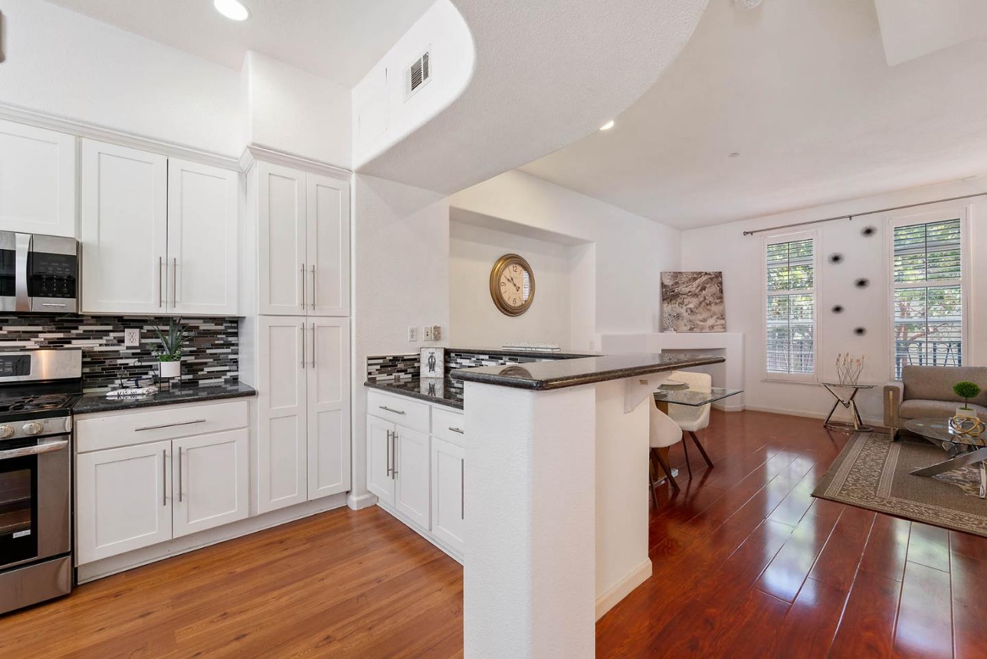 43 Rain Walk Milpitas, CA 95035 - Photo 10 of 48 a view of a kitchen with microwave and furniture