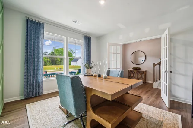 a bathroom with double vanity sink and a mirror