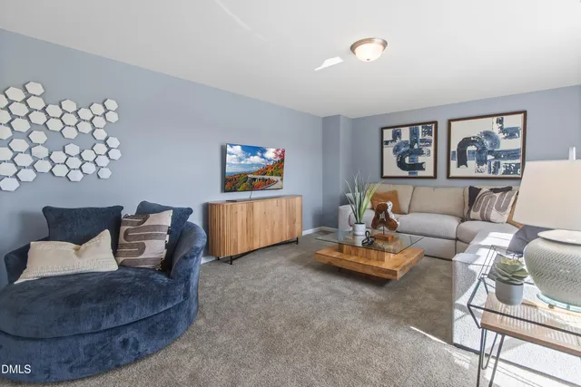 a living room with furniture and a couch