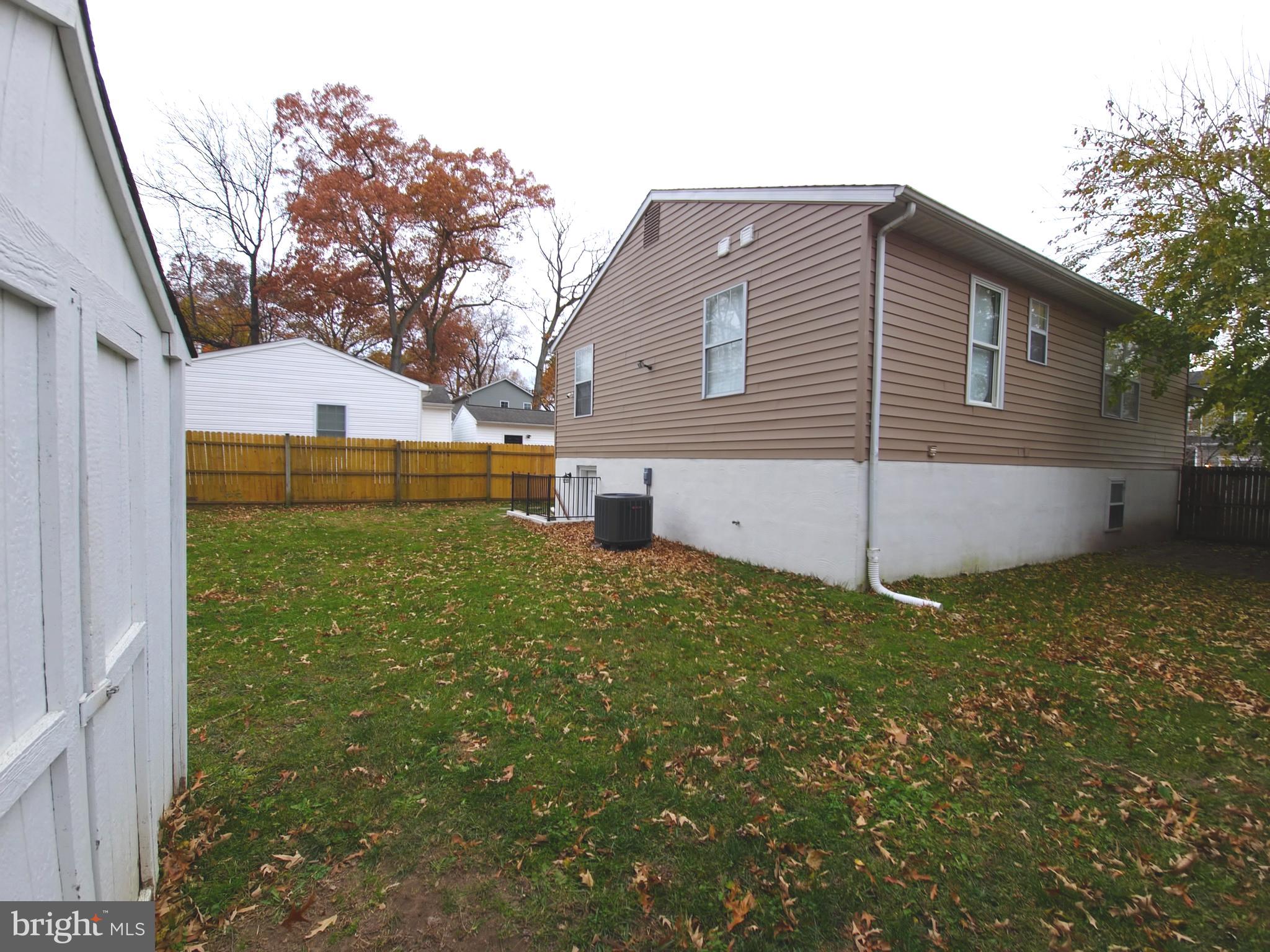 809 Duvall Highway Pasadena, MD 21122 - Photo 36 of 38 a backyard of a house with lots of green space