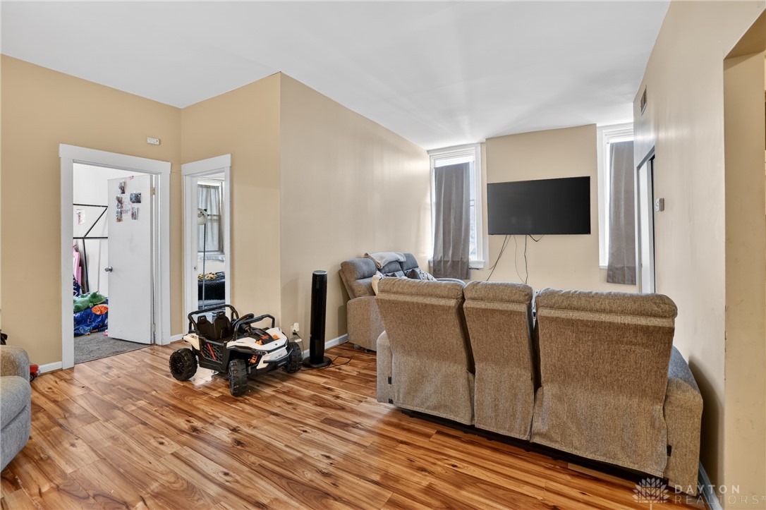 7045-7049 Montgomery Road Cincinnati, OH 45236 - Photo 56 of 68 This inviting living space features warm flooring and ample natural light, perfect for everyday living.