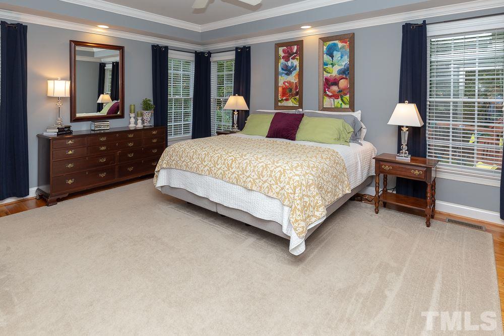 5004 Martin Farm Road Raleigh, NC 27613 - Photo 14 of 25 a bedroom with a bed dresser and window