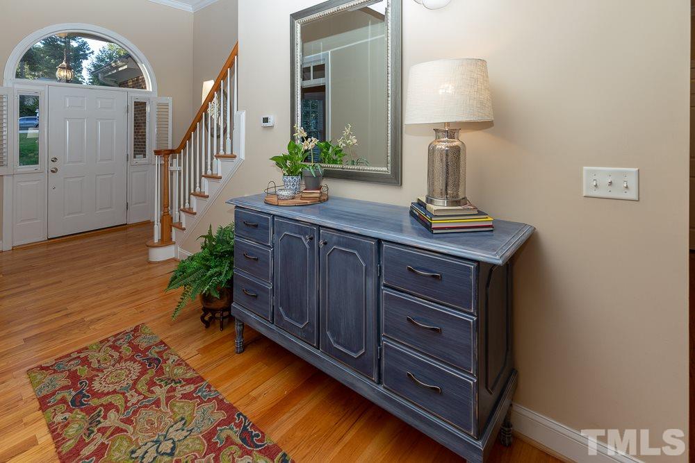 5004 Martin Farm Road Raleigh, NC 27613 - Photo 3 of 25 a room with furniture and a lamp