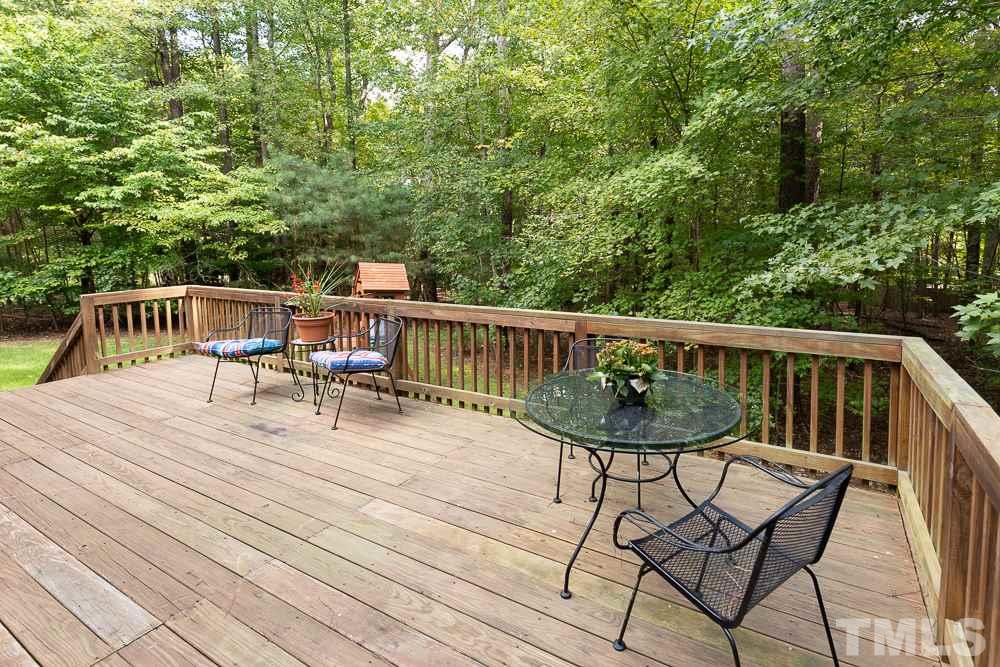 5004 Martin Farm Road Raleigh, NC 27613 - Photo 24 of 25 a view of backyard with deck and outdoor seating