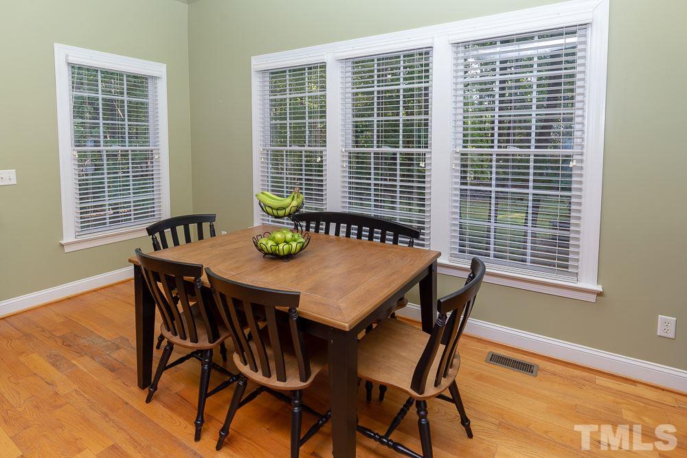5004 Martin Farm Road Raleigh, NC 27613 - Photo 9 of 25 a view of a dining room with furniture and window
