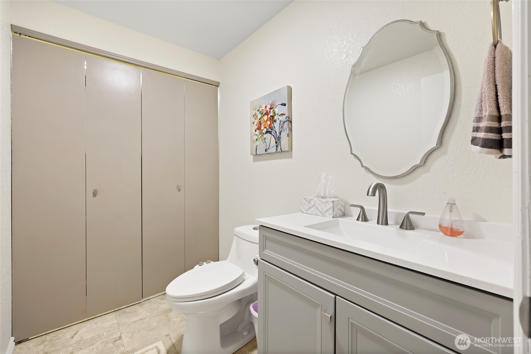 2715 Walnut Loop Northwest Olympia, WA 98502 - Photo 14 of 37 a bathroom with a toilet a sink and a mirror