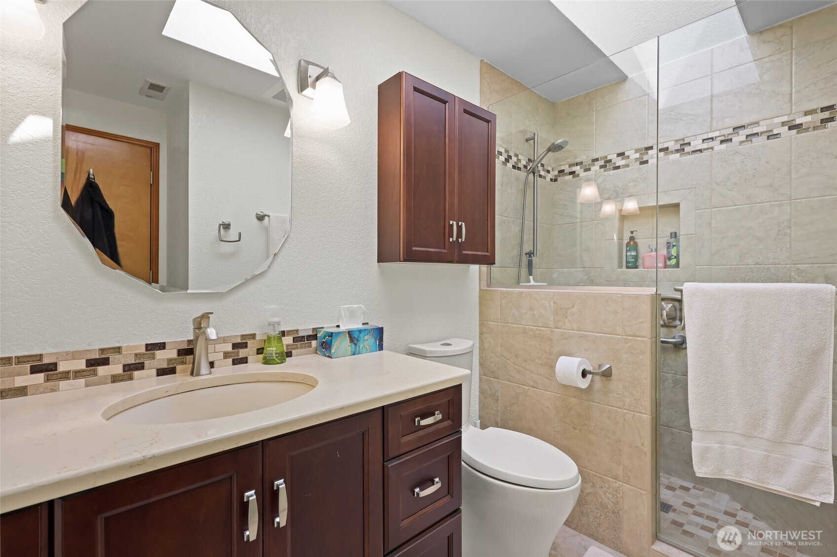 2715 Walnut Loop Northwest Olympia, WA 98502 - Photo 19 of 37 a bathroom with a granite countertop toilet sink and mirror