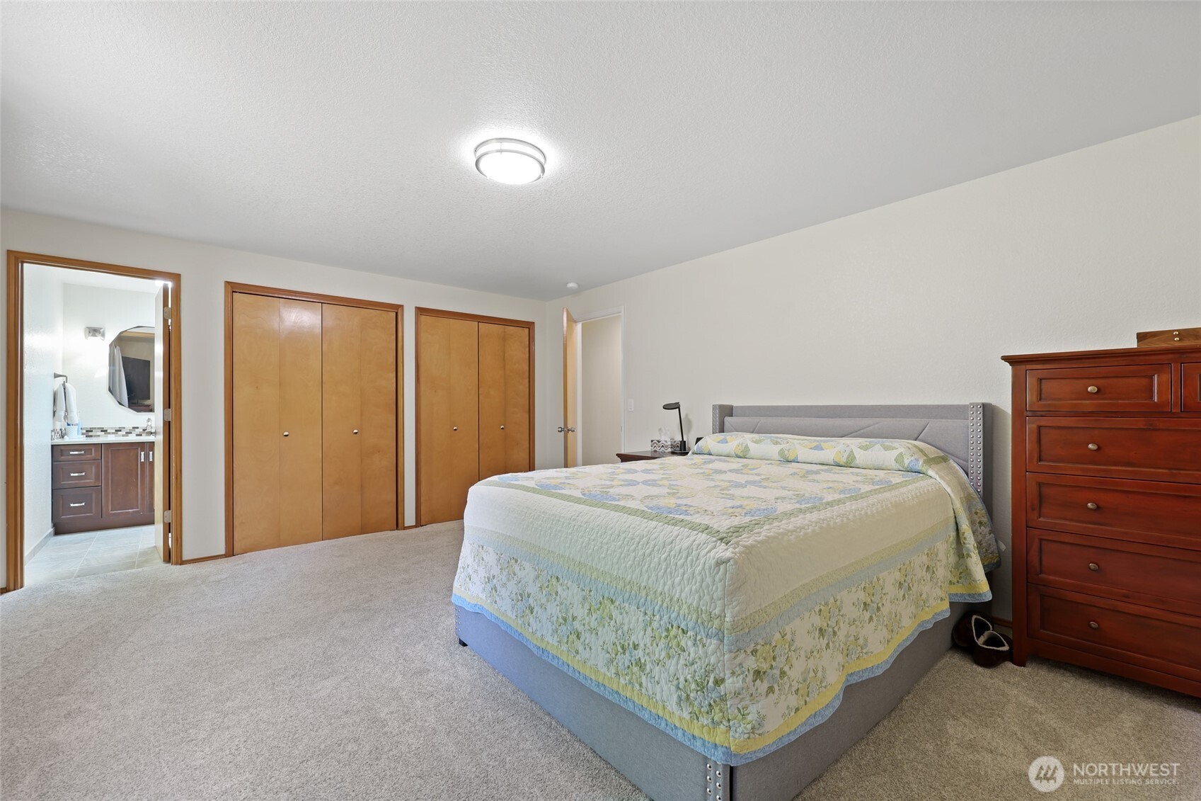 2715 Walnut Loop Northwest Olympia, WA 98502 - Photo 20 of 37 a bedroom with a bed and cabinet