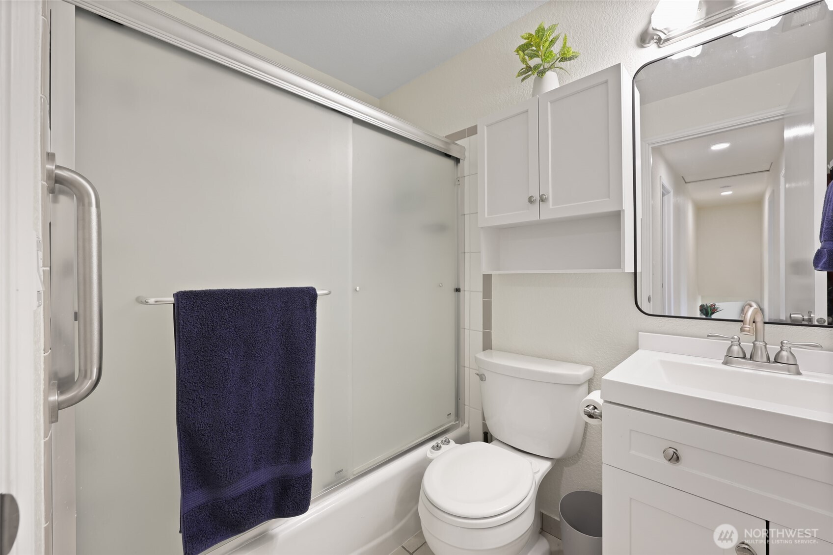 2715 Walnut Loop Northwest Olympia, WA 98502 - Photo 22 of 37 a bathroom with a sink a toilet and shower