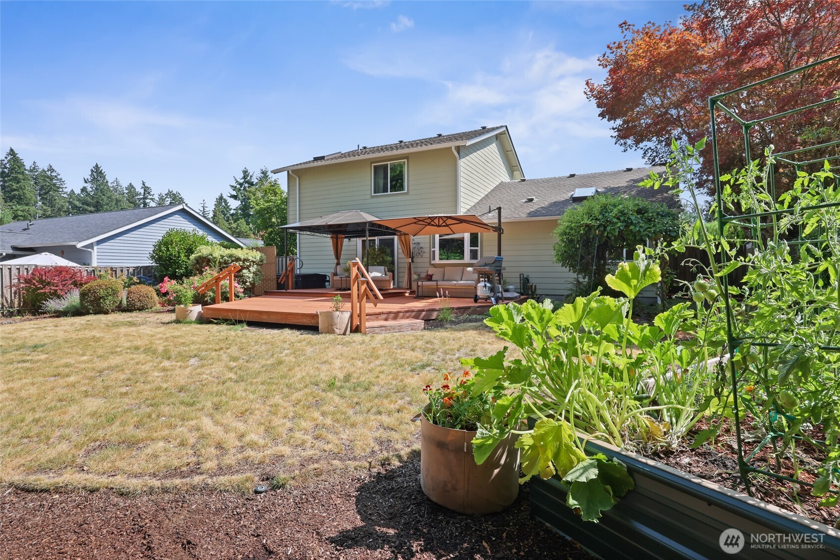 2715 Walnut Loop Northwest Olympia, WA 98502 - Photo 28 of 37 a front view of a house with garden