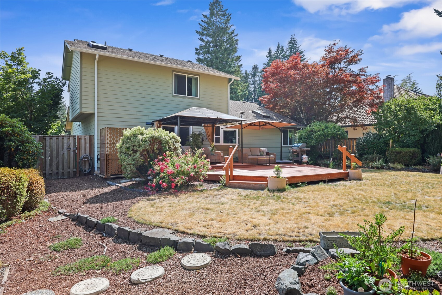 2715 Walnut Loop Northwest Olympia, WA 98502 - Photo 31 of 37 a view of a house with backyard and sitting area