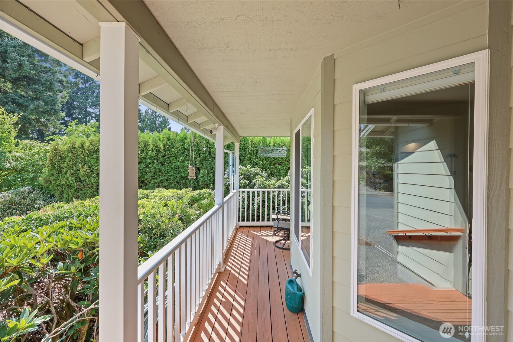 2715 Walnut Loop Northwest Olympia, WA 98502 - Photo 35 of 37 a view of a balcony with a floor to ceiling window and wooden floor