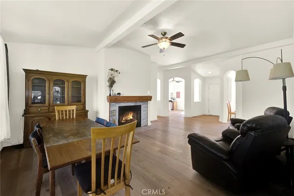 a living room with furniture a window and a flat screen tv