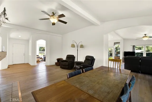 a living room with furniture a rug and a window