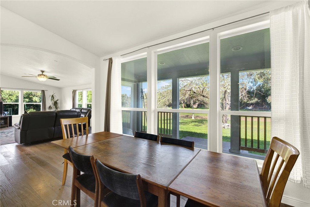 23580 Loleta Avenue Corning, CA 96021 - Photo 14 of 70 a view of a dining room with furniture window and wooden floor