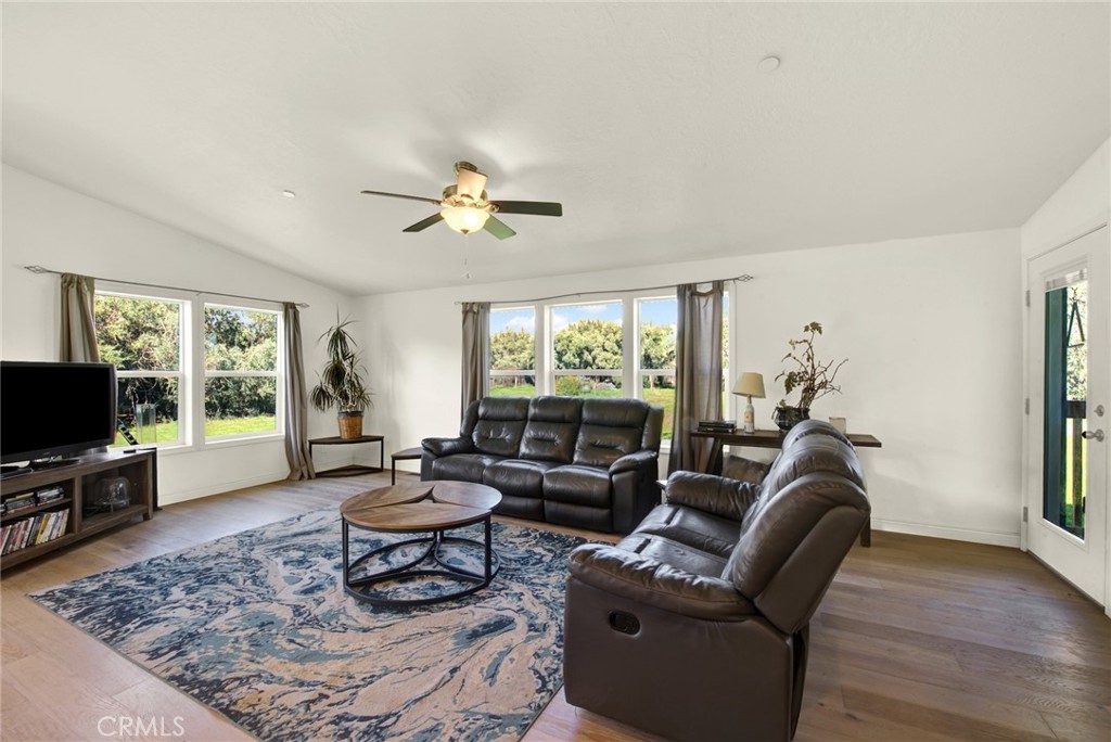 23580 Loleta Avenue Corning, CA 96021 - Photo 17 of 70 a living room with furniture a window and a flat screen tv