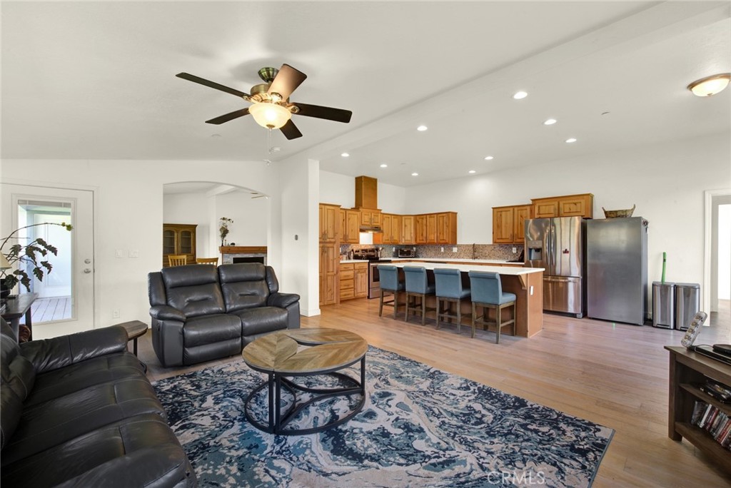 23580 Loleta Avenue Corning, CA 96021 - Photo 19 of 70 a living room with lots of furniture kitchen view and a chandelier