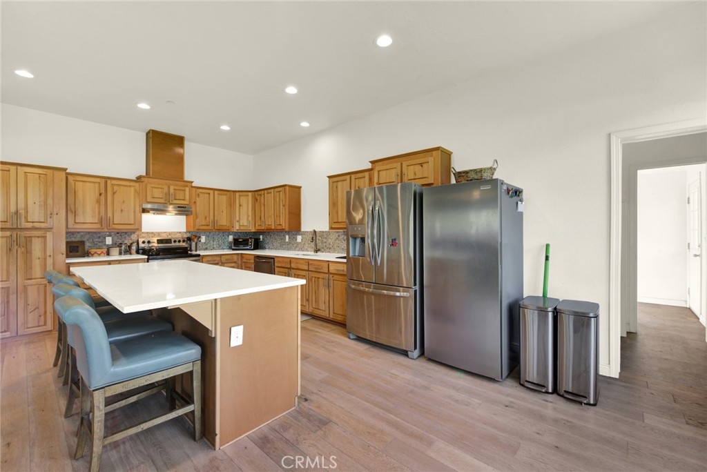 23580 Loleta Avenue Corning, CA 96021 - Photo 21 of 70 a kitchen with stainless steel appliances granite countertop a refrigerator a stove and a sink