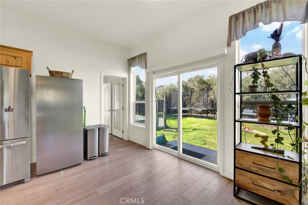 23580 Loleta Avenue Corning, CA 96021 - Photo 32 of 70 a view of kitchen with refrigerator and wooden floor