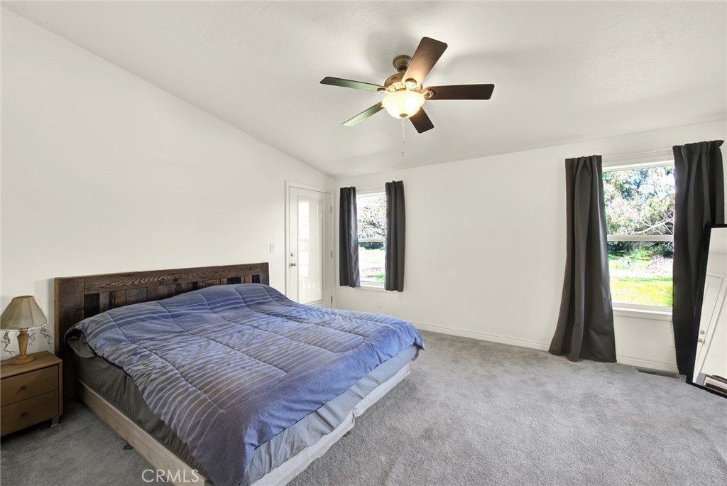 23580 Loleta Avenue Corning, CA 96021 - Photo 35 of 70 a bedroom with a large bed and a window