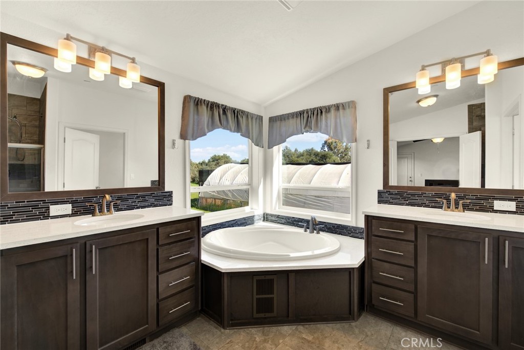 23580 Loleta Avenue Corning, CA 96021 - Photo 39 of 70 a bathroom with a sink double vanity and a mirror