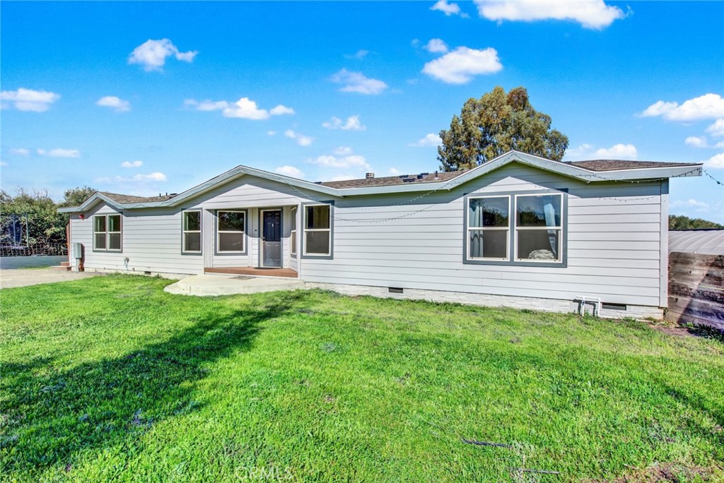 23580 Loleta Avenue Corning, CA 96021 - Photo 7 of 70 a front view of a house with a garden