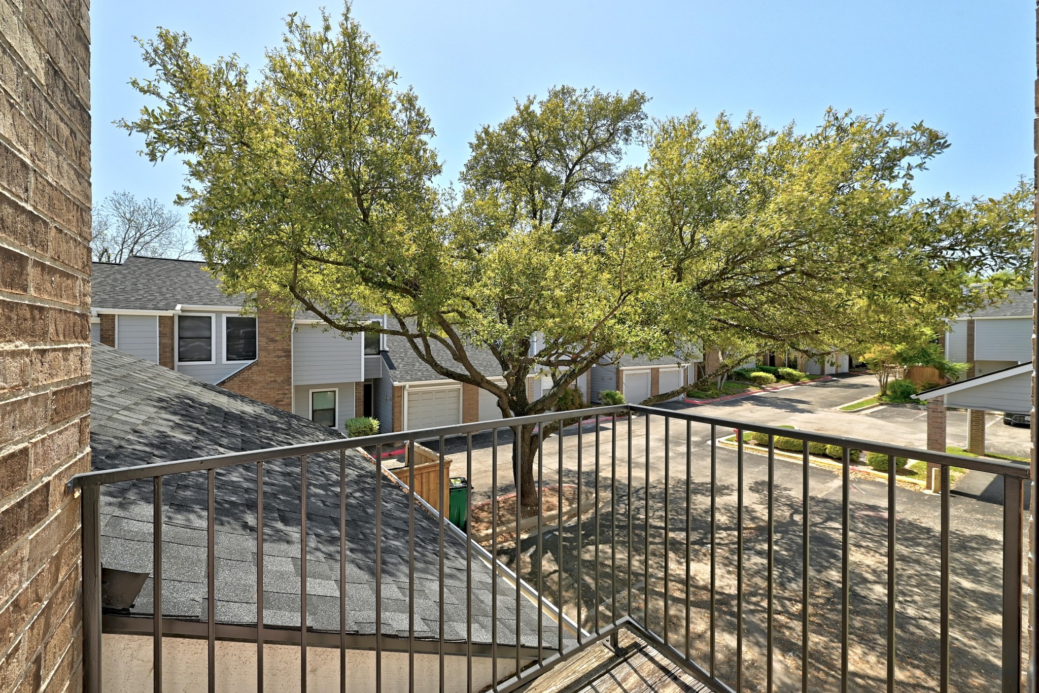 7635 Guadalupe Street, Unit 1002 Austin, TX 78752 - Photo 21 of 27 a view of a house with backyard and trees