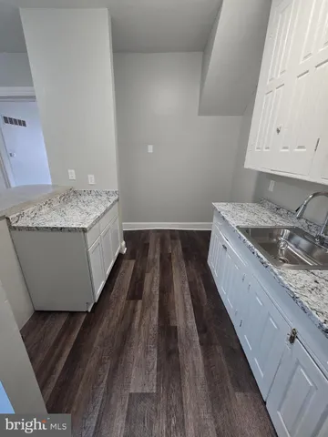 a room with a bed and a stove top oven