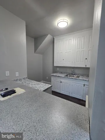 a bedroom with a bed and a mirror