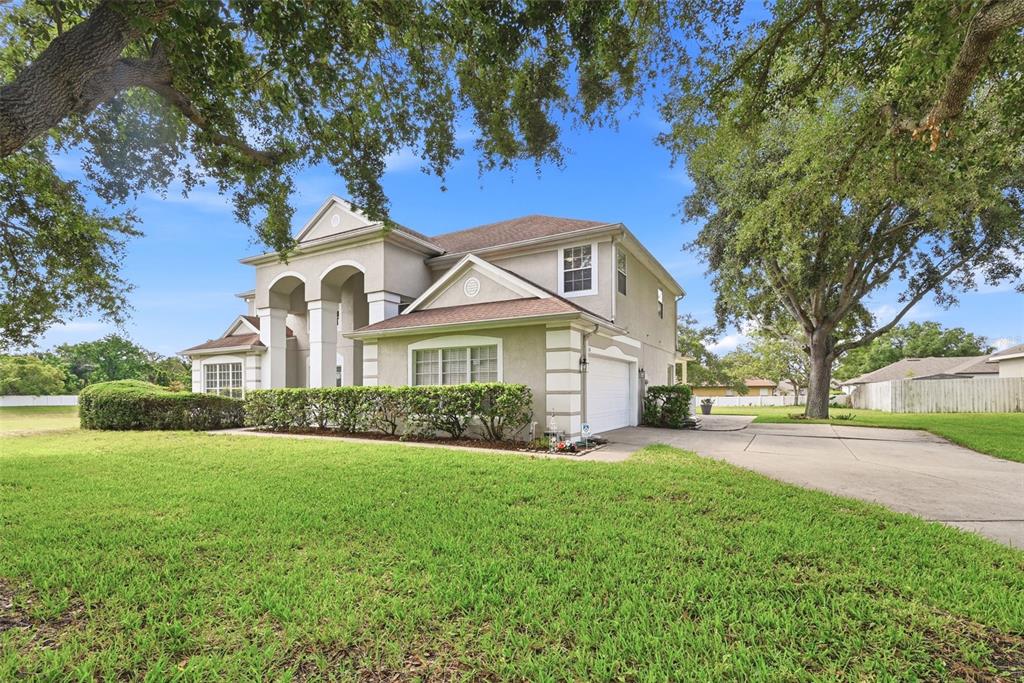 936 Kingsridge Circle Gotha, FL 34734 - Photo 36 of 50 a front view of a house with a yard and garage