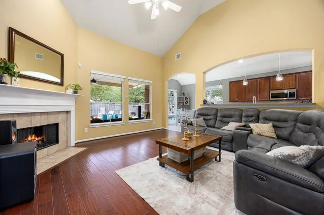a living room with furniture and a fireplace
