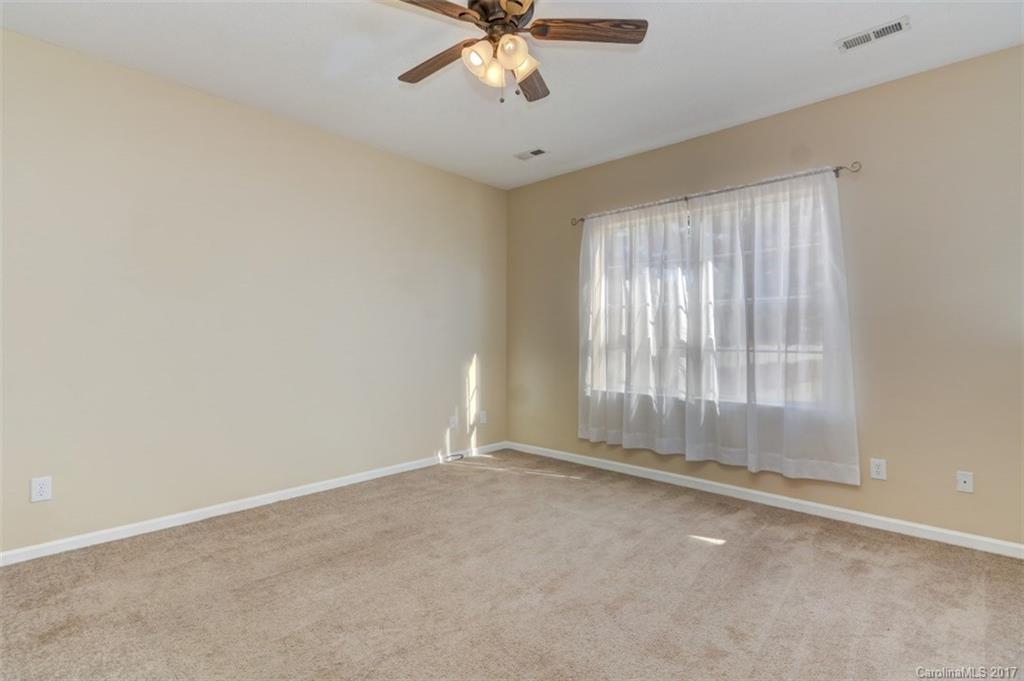 12206 Marathon Hill Road Charlotte, NC 28269 - Photo 11 of 23 a view of an empty room with a window