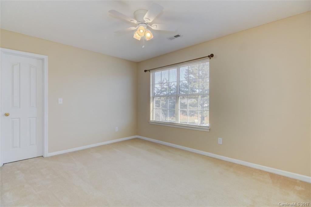 12206 Marathon Hill Road Charlotte, NC 28269 - Photo 14 of 23 an empty room with a window