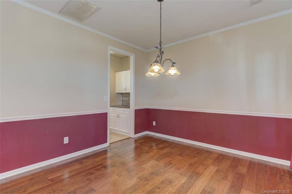 12206 Marathon Hill Road Charlotte, NC 28269 - Photo 6 of 23 a view of room with window and wooden floor