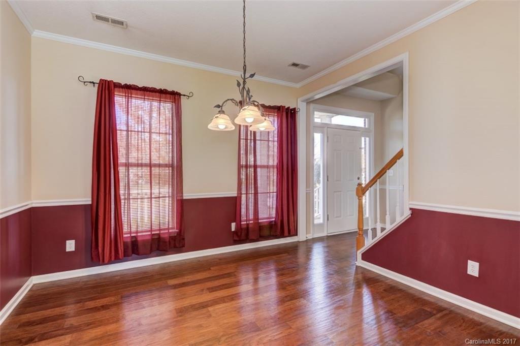 12206 Marathon Hill Road Charlotte, NC 28269 - Photo 7 of 23 a view of a room with wooden floor and windows