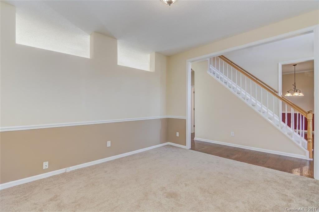 12206 Marathon Hill Road Charlotte, NC 28269 - Photo 9 of 23 a view of an empty room with stairs