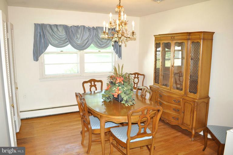 1407 Mt Airy Road Rosedale, MD 21237 - Photo 20 of 27 Formal dining room with hardwood floor